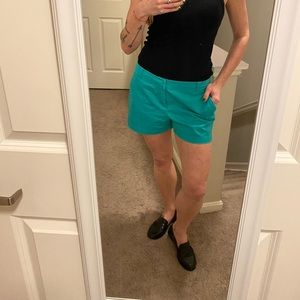 NY & Co teal shorts, zip fly, w/ pockets. Size 6